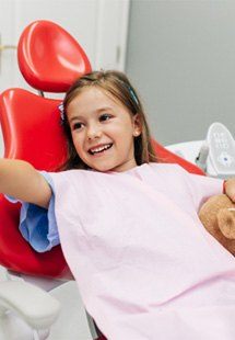 Child high-fiving pediatric dentist near Dunwoody